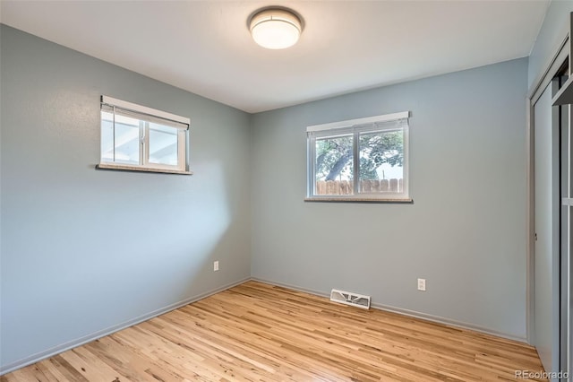 1785 S Zuni St, Denver, CO 80223 - unfurnished bedroom with light wood-type flooring and a closet