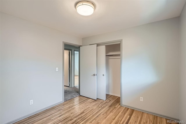 1785 S Zuni St, Denver, CO 80223 - unfurnished bedroom featuring light wood-type flooring and a closet