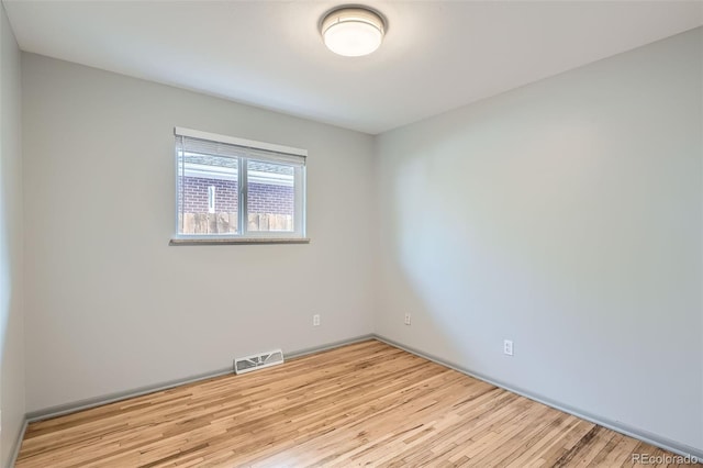 1785 S Zuni St, Denver, CO 80223 - spare room with wood finished floors and baseboards