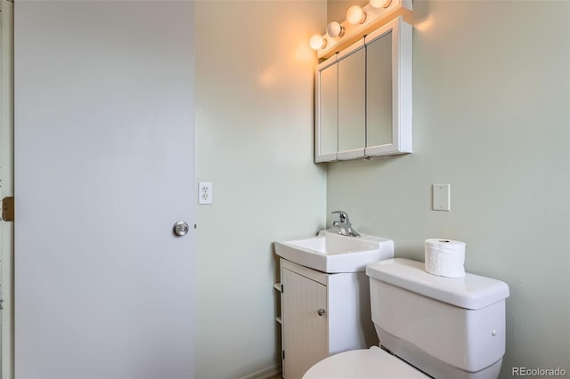 1785 S Zuni St, Denver, CO 80223 - half bathroom with toilet and vanity