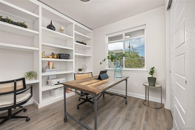 office featuring baseboards and wood finished floors