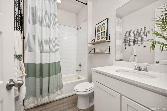 full bathroom with vanity, wood finished floors, shower / bath combo, and toilet