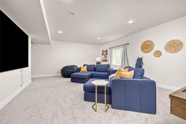 carpeted living area with recessed lighting, baseboards, and visible vents
