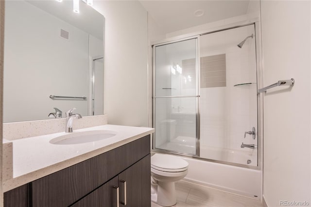 6892 Juniper Ct, Arvada, CO 80007 - bathroom with vanity and shower / bath combination with glass door