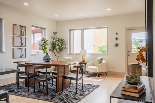 6892 Juniper Ct, Arvada, CO 80007 - dining room with wood finished floors and recessed lighting