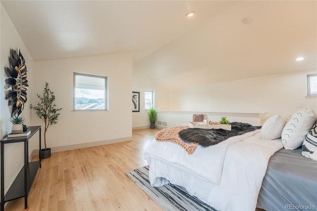 6892 Juniper Ct, Arvada, CO 80007 - bedroom featuring vaulted ceiling, multiple windows, light wood finished floors, and recessed lighting