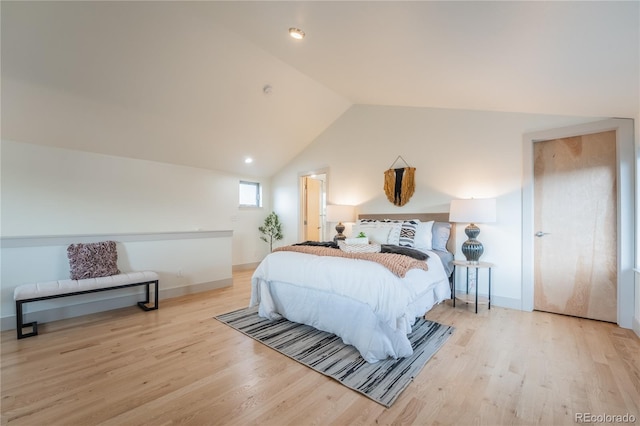 6892 Juniper Ct, Arvada, CO 80007 - bedroom with light wood-style floors and lofted ceiling