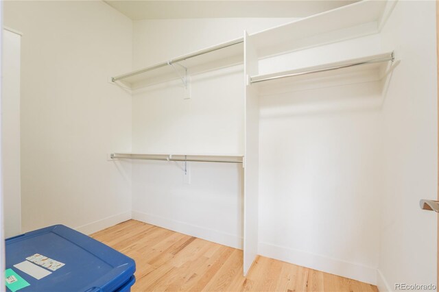 6892 Juniper Ct, Arvada, CO 80007 - spacious closet with wood finished floors