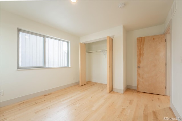 6892 Juniper Ct, Arvada, CO 80007 - unfurnished bedroom featuring wood finished floors and a closet
