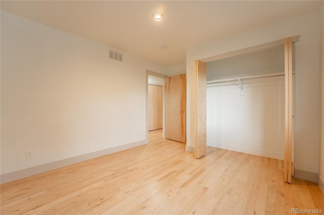 6892 Juniper Ct, Arvada, CO 80007 - unfurnished bedroom with wood finished floors and a closet
