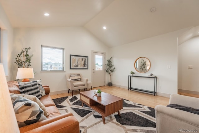6892 Juniper Ct, Arvada, CO 80007 - living area with light wood-type flooring, vaulted ceiling, and recessed lighting