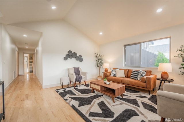 6892 Juniper Ct, Arvada, CO 80007 - living room with light wood finished floors, recessed lighting, and high vaulted ceiling
