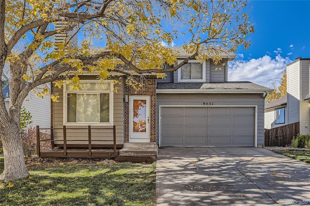 view of front of house featuring a garage and a front yard