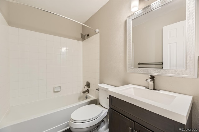 full bathroom featuring vanity, toilet, and tiled shower / bath combo