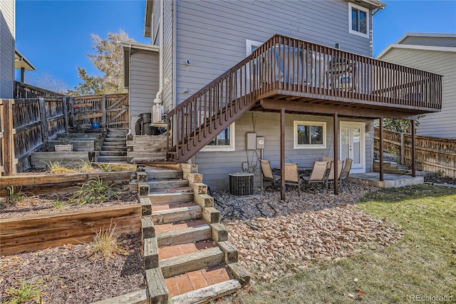 back of property featuring a patio area, cooling unit, french doors, and a wooden deck