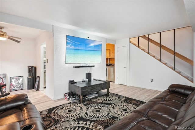 living room with ceiling fan and light hardwood / wood-style floors