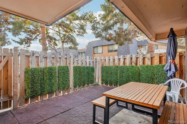 view of patio with fence private yard and outdoor dining space