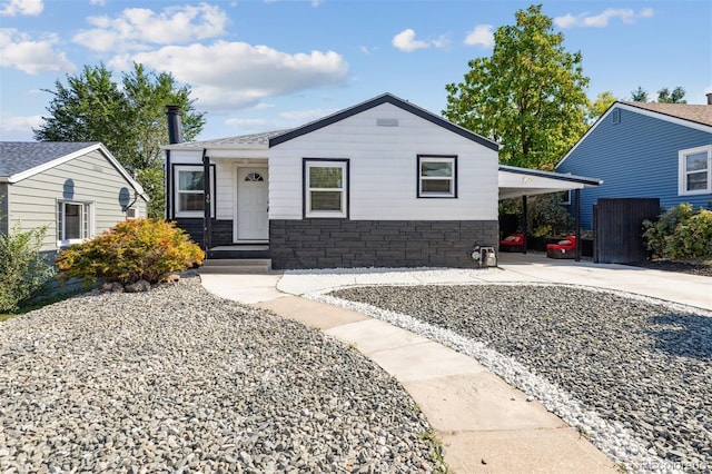 view of front of home featuring a carport