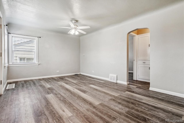 spare room featuring hardwood / wood-style floors and ceiling fan