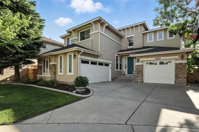 10601 Chadsworth Ln, Highlands Ranch, CO 80126 - view of front of home featuring stone siding, a garage, stucco siding, driveway, and a front lawn
