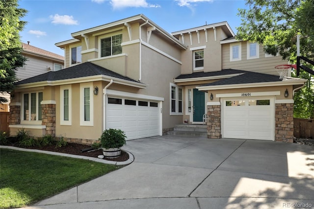 10601 Chadsworth Ln, Highlands Ranch, CO 80126 - view of front facade featuring driveway, stone siding, stucco siding, and a garage