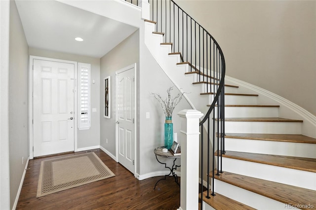10601 Chadsworth Ln, Highlands Ranch, CO 80126 - foyer with wood finished floors, stairway, and recessed lighting