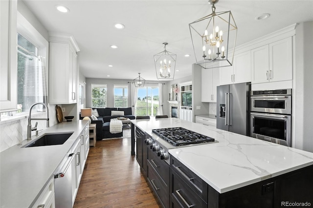 10601 Chadsworth Ln, Highlands Ranch, CO 80126 - kitchen featuring stainless steel appliances, a chandelier, white cabinetry, recessed lighting, and dark cabinets