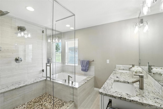 10601 Chadsworth Ln, Highlands Ranch, CO 80126 - bathroom with a stall shower, a garden tub, double vanity, and recessed lighting