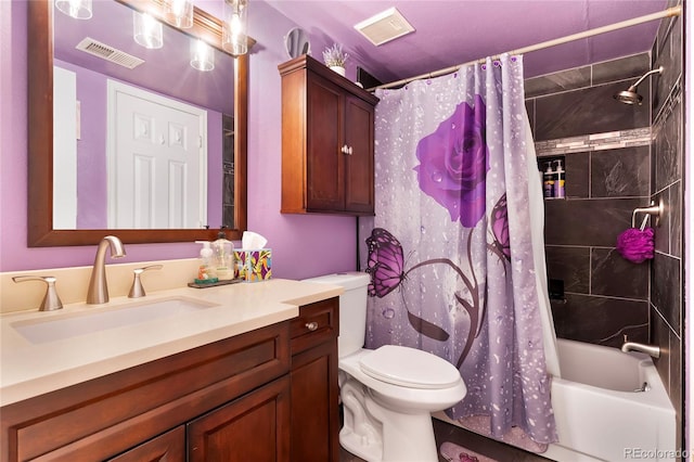 bathroom featuring toilet, shower / tub combo, visible vents, and vanity