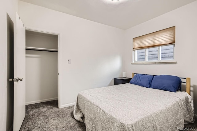 bedroom with baseboards and carpet