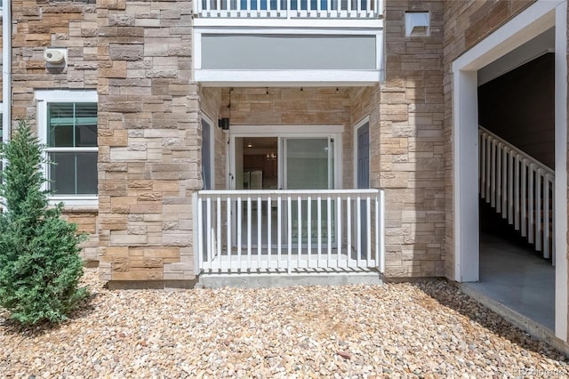 1881 S Dunkirk St Unit 106, Aurora, CO 80017 - doorway to property with stone siding