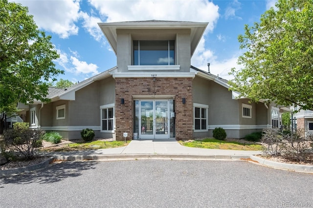 1881 S Dunkirk St Unit 106, Aurora, CO 80017 - exterior space with stucco siding and brick siding