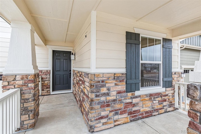 20724 E 57th Ave, Aurora, CO 80019 - property entrance featuring a porch and stone siding