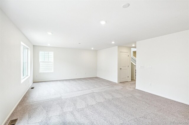 20724 E 57th Ave, Aurora, CO 80019 - empty room featuring light colored carpet, recessed lighting, and baseboards