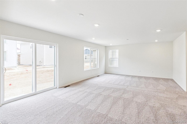 20724 E 57th Ave, Aurora, CO 80019 - empty room with light carpet, recessed lighting, and baseboards