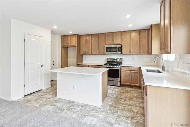 20724 E 57th Ave, Aurora, CO 80019 - kitchen with stainless steel appliances, a sink, brown cabinets, decorative backsplash, and light countertops