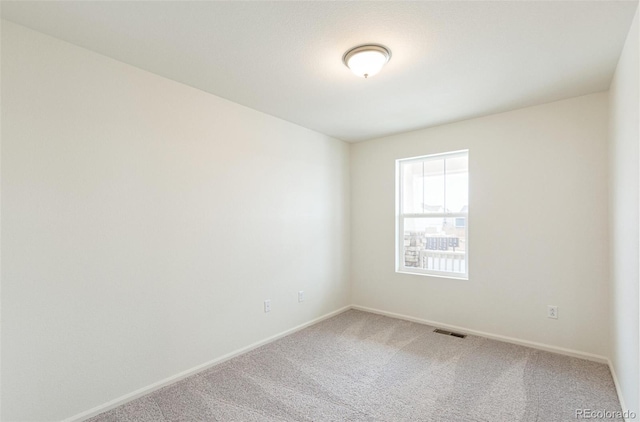 20724 E 57th Ave, Aurora, CO 80019 - carpeted spare room featuring baseboards