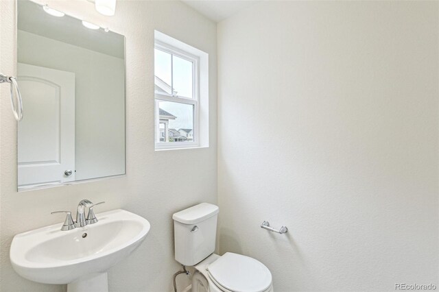 20724 E 57th Ave, Aurora, CO 80019 - half bathroom with a sink and toilet