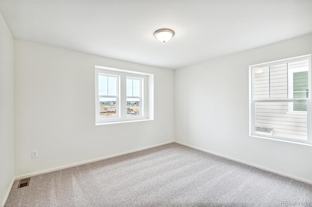 20724 E 57th Ave, Aurora, CO 80019 - carpeted spare room featuring baseboards