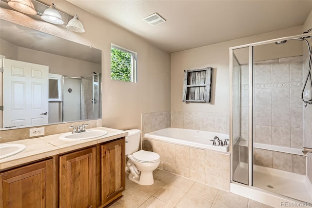 13018 Niagara Way, Thornton, CO 80602 - bathroom featuring tile patterned floors, a shower stall, double vanity, and a bath