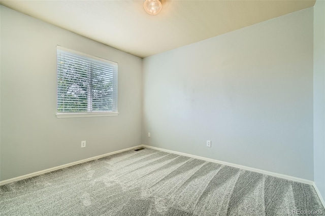 13018 Niagara Way, Thornton, CO 80602 - spare room featuring baseboards and carpet