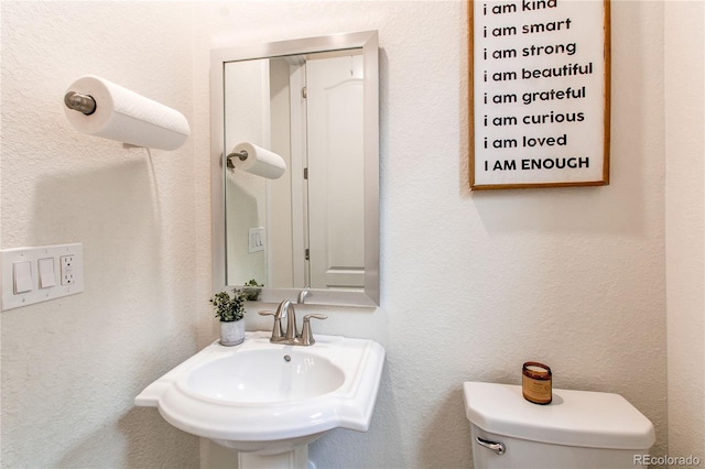 8107 Arapahoe Peak St, Littleton, CO 80125 - half bathroom featuring toilet and a sink
