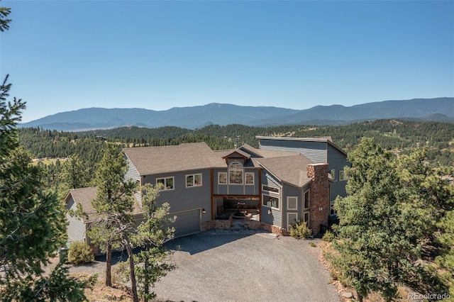 view of front of home featuring a garage and a mountain view