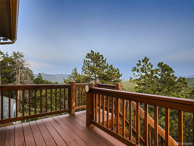 wooden terrace with a mountain view