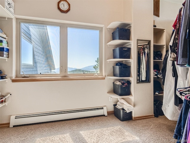 walk in closet featuring a baseboard radiator