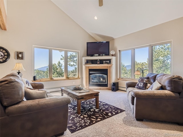 living room featuring a high end fireplace, high vaulted ceiling, baseboard heating, and carpet