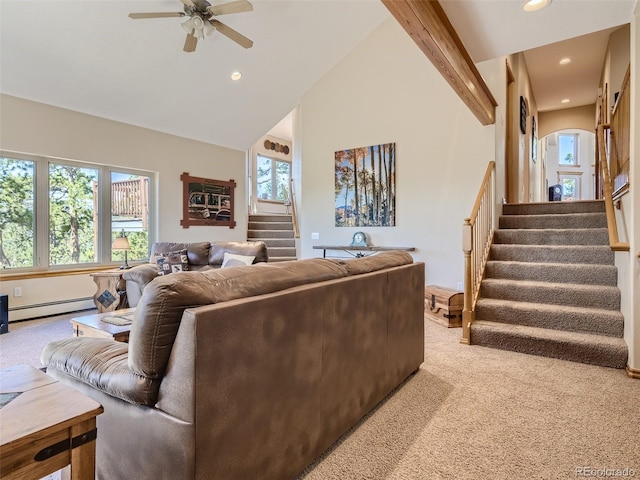 living room with ceiling fan, a baseboard radiator, light colored carpet, and a healthy amount of sunlight