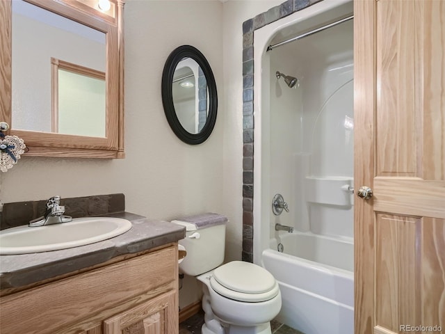 full bathroom featuring vanity, bathing tub / shower combination, and toilet