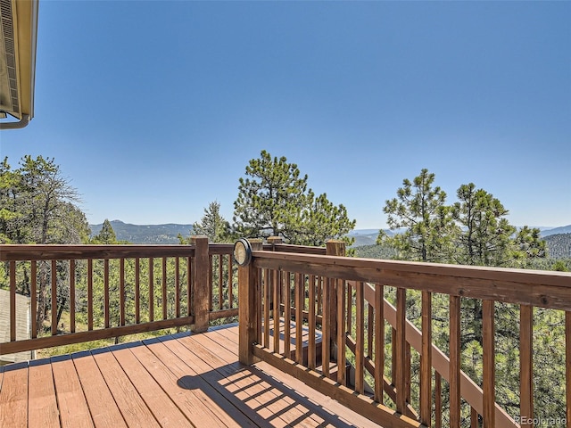 wooden terrace with a mountain view