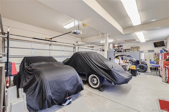 garage featuring a garage door opener